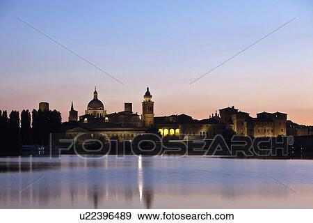 City skyline reflected in lake at sunset View Large Photo Image Stock Photo - City skyline reflected in lake at sunset. Fotosearch