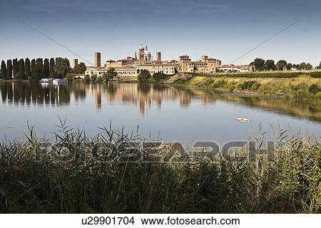 Picture - City skyline reflected in still lake. Fotosearch