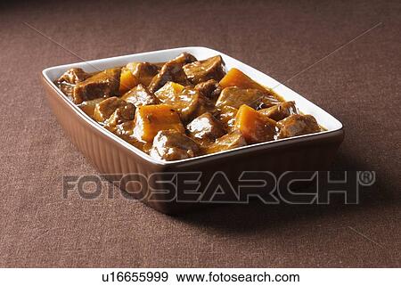 Stock Photo - Close up of beef casserole with carrots. Fotosearch