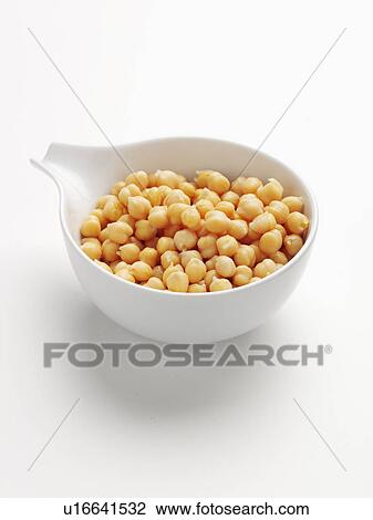 Stock Image - Close up of bowl of chickpeas. Fotosearch