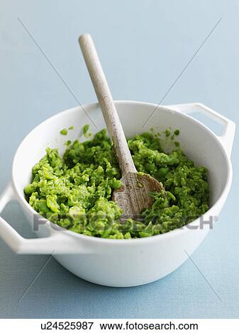 Stock Photo - Close up of bowl of mashed avocado. Fotosearch