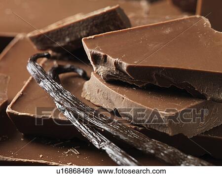 Stock Photo - Close up of chocolate with vanilla beans. Fotosearch