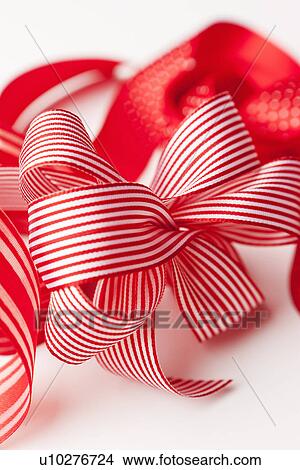 Picture - Close up of decorative red ribbons. Fotosearch