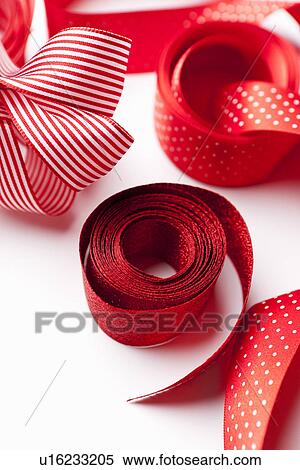 Stock Photography - Close up of decorative red ribbons. Fotosearch