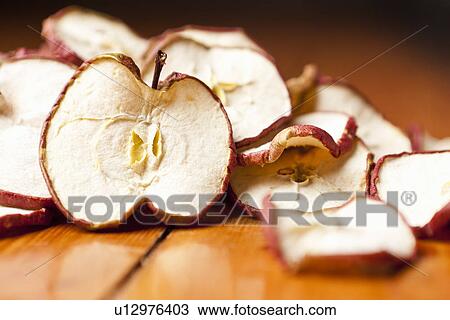 Stock Image - Close up of dried apple slices. Fotosearch