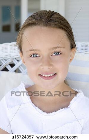 Stock Photo - Close up of girls smiling face. Fotosearch