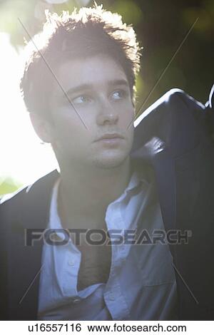 Stock Photograph - Close up of man standing outdoors. Fotosearch