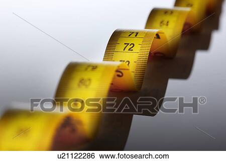 Close up of measuring tape View Large Photo Image Stock Photograph - Close up of measuring tape. Fotosearch