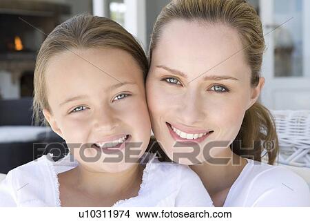Close up of mother and daughters faces View Large Photo Image Picture - Close up of mother and daughters faces. Fotosearch