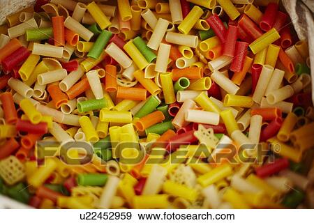 Close up of multicolored dried pasta View Large Photo Image Stock Photo - Close up of multicolored dried pasta. Fotosearch