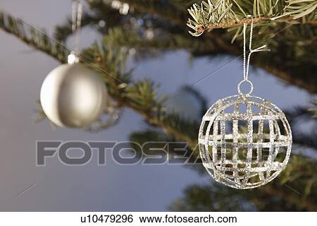 Close up of ornament on Christmas tree View Large Photo Image Stock Photograph - Close up of ornament on Christmas tree. Fotosearch
