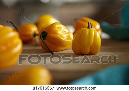 Stock Photo - Close up of peppers on counter. Fotosearch