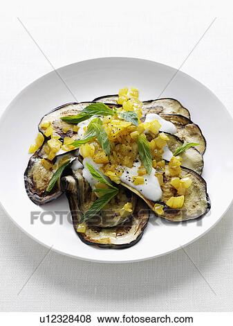 Close up of plate of grilled eggplant View Large Photo Image Stock Photo - Close up of plate of grilled eggplant. Fotosearch