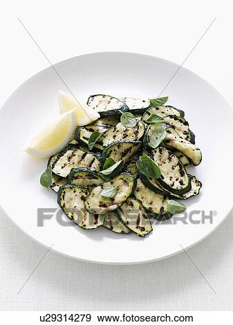 Stock Photo - Close up of plate of grilled zucchini. Fotosearch
