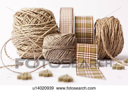 Stock Photo - Close up of ribbon, string and buttons. Fotosearch