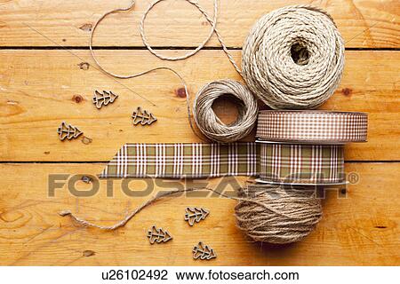 Stock Image - Close up of ribbon, string and shapes. Fotosearch