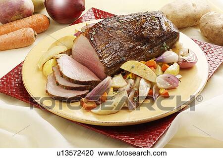 Close up of roast beef and vegetables View Large Photo Image Stock Image - Close up of roast beef and vegetables. Fotosearch