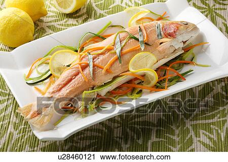 Stock Image - Close up of salmon and vegetables. Fotosearch