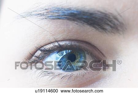 Stock Image - Close up of womans blue eye. Fotosearch