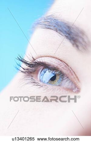 Close up of womans blue eye View Large Photo Image Stock Photography - Close up of womans blue eye. Fotosearch