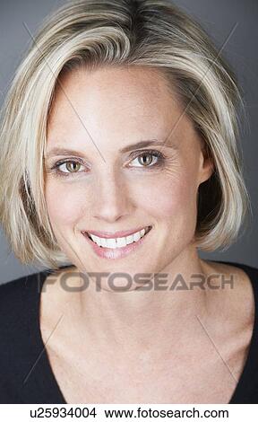 Close up of womans smiling face View Large Photo Image Picture - Close up of womans smiling face. Fotosearch