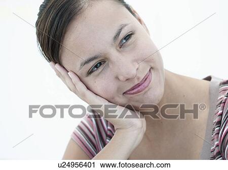 Stock Image - Close up of womans smiling face. Fotosearch