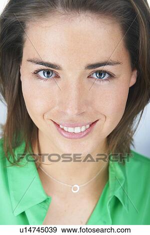 Stock Photo - Close up of womans smiling face. Fotosearch