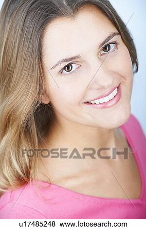 Stock Photo - Close up of womans smiling face. Fotosearch