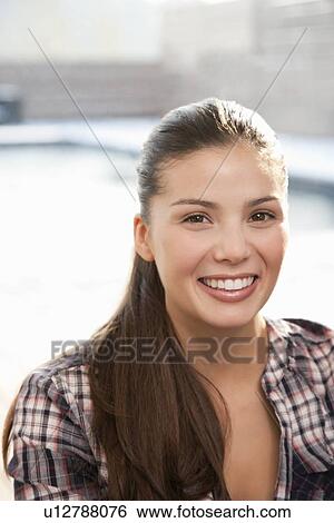 Stock Photograph - Close up of womans smiling face. Fotosearch