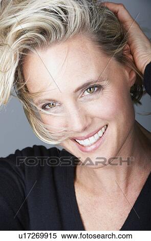 Close up of womans smiling face View Large Photo Image Stock Photography - Close up of womans smiling face. Fotosearch