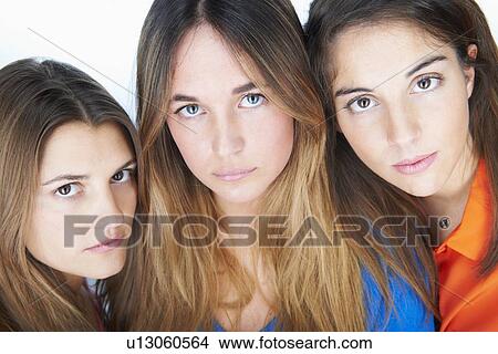 Close up of womens serious faces View Large Photo Image Picture - Close up of womens serious faces. Fotosearch
