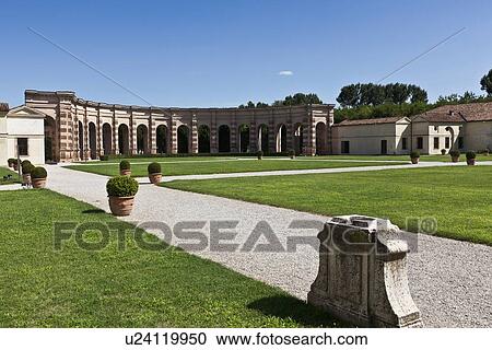 Stock Image - Colonnade with manicured gardens. Fotosearch