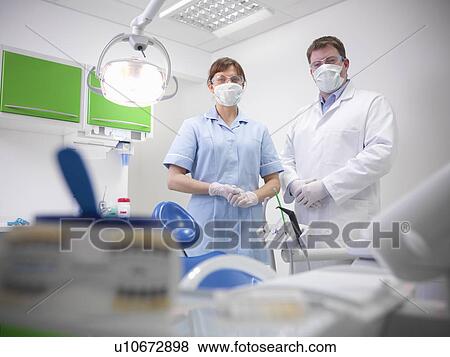 Stock Photo - Dental student and dentist in surgery. Fotosearch