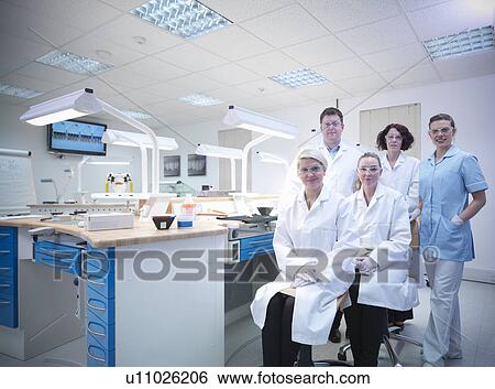 Stock Photograph - Dentist and dental students in lab. Fotosearch