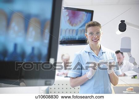 Dentist teaching students in lab View Large Photo Image Stock Image - Dentist teaching students in lab. Fotosearch
