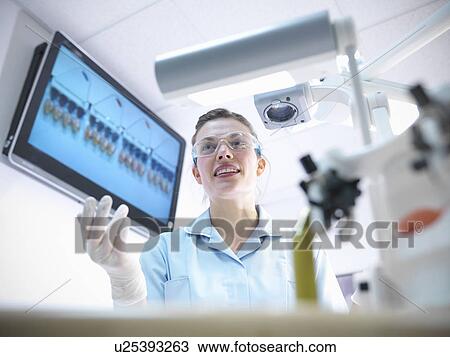 Dentist teaching students in lab View Large Photo Image Stock Image - Dentist teaching students in lab. Fotosearch