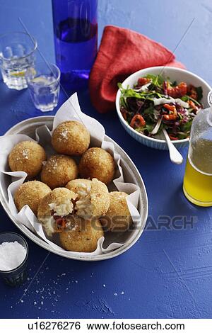 Dish of risotto balls with salad View Large Photo Image Stock Photograph - Dish of risotto balls with salad. Fotosearch
