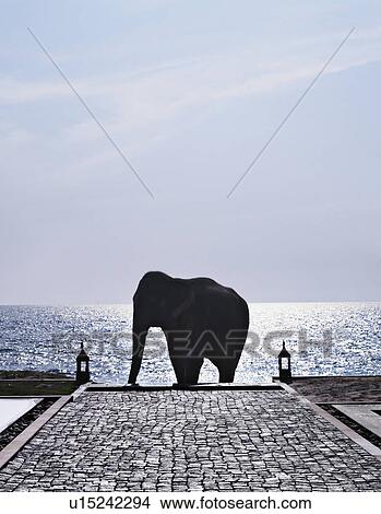 Picture - Elephant statue on cobbled walkway. Fotosearch