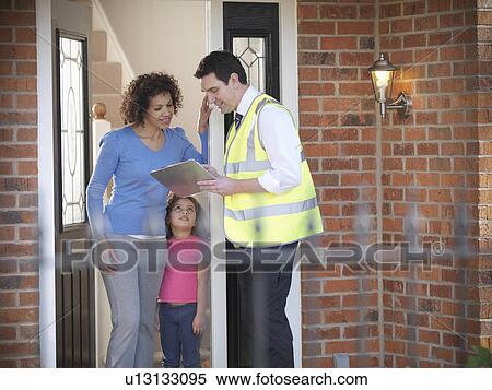 Energy worker talking to family View Large Photo Image Stock Photography - Energy worker talking to family. Fotosearch