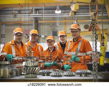 Engineer teaching apprentices in factory View Large Photo Image Stock Image - Engineer teaching apprentices in factory. Fotosearch