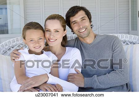 Family relaxing on sofa together View Large Photo Image Stock Image - Family relaxing on sofa together. Fotosearch