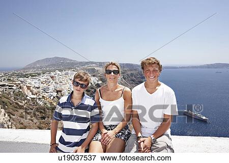 Family smiling on balcony together View Large Photo Image Stock Photo - Family smiling on balcony together. Fotosearch