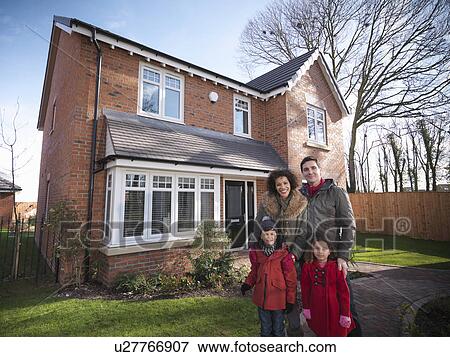 Family smiling outside house View Large Photo Image Stock Photo - Family smiling outside house. Fotosearch