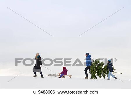 Family walking together in snow View Large Photo Image Stock Photograph - Family walking together in snow. Fotosearch
