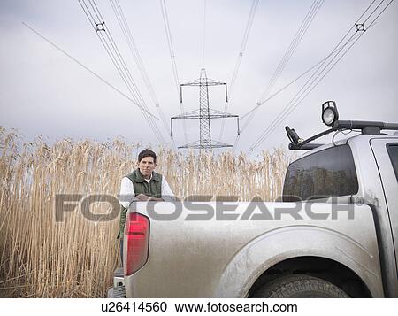 Farmer with truck in elephant grass View Large Photo Image Stock Image - Farmer with truck in elephant grass. Fotosearch