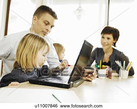 Father and daughter using laptop View Large Photo Image Stock Photograph - Father and daughter using laptop. Fotosearch