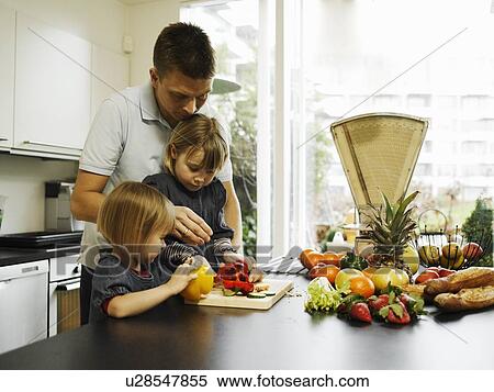 Father and daughters chopping peppers View Large Photo Image Stock Photography - Father and daughters chopping peppers. Fotosearch
