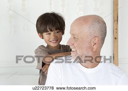 Father and son smiling together View Large Photo Image Stock Photo - Father and son smiling together. Fotosearch