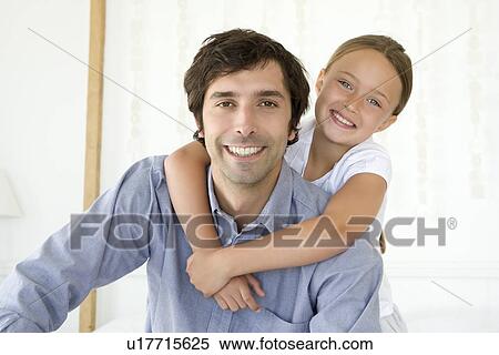Father carrying daughter piggy back View Large Photo Image Stock Photography - Father carrying daughter piggy back. Fotosearch