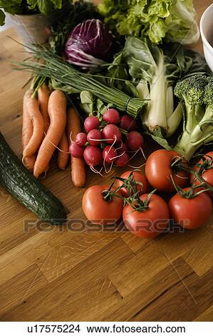 Fresh vegetables on wooden table View Large Photo Image Picture - Fresh vegetables on wooden table. Fotosearch
